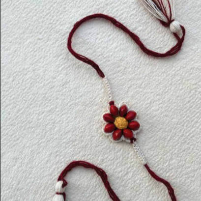 Seed Rakhi pack (with chawal and Kumkum) - Love is in the air (Red Bead Flower)