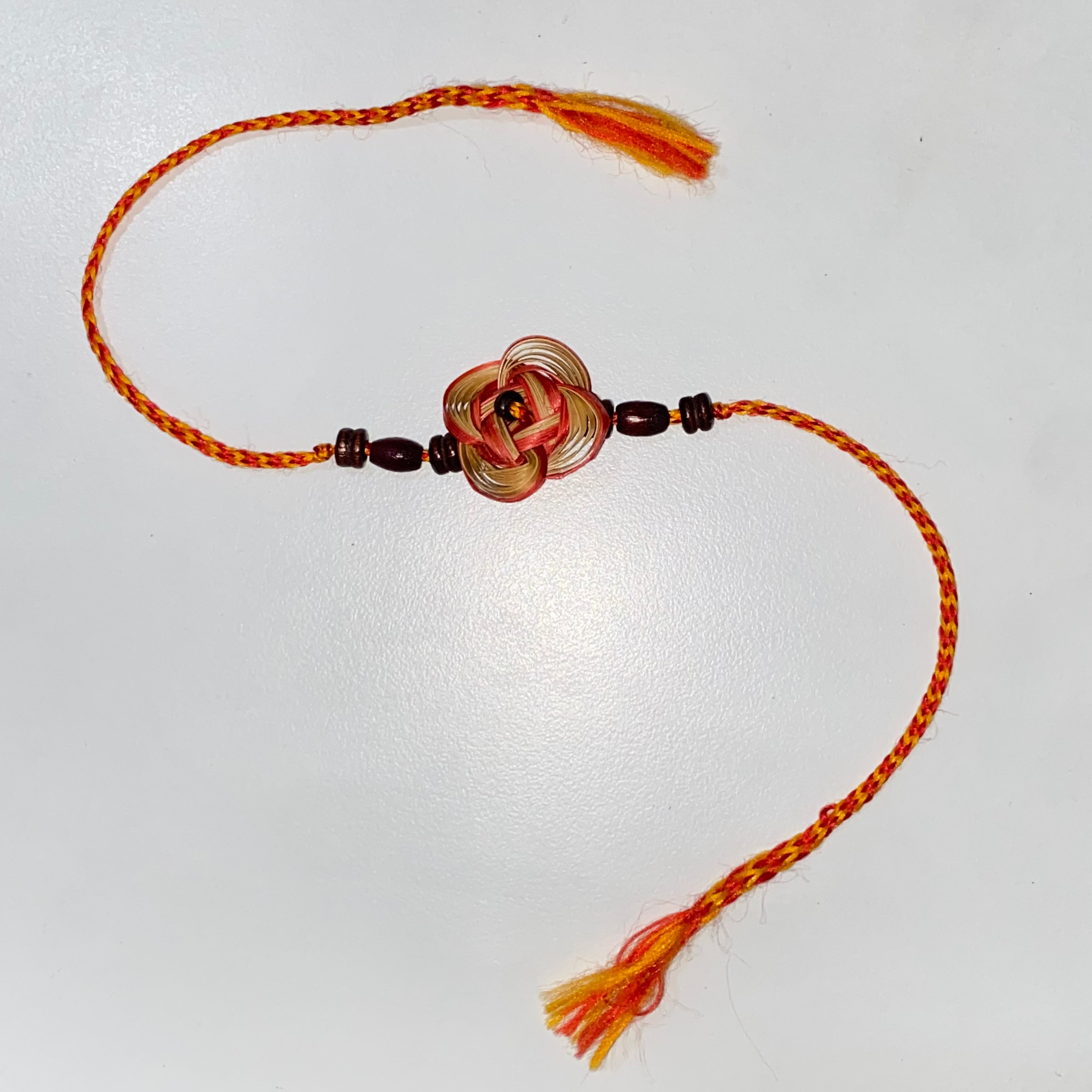 Orange Bamboo Flower Rakhi