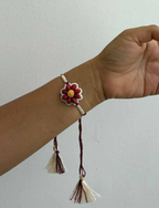 Seed Rakhi pack (with chawal and Kumkum) - Love is in the air (Red Bead Flower)