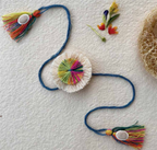 Seed Rakhi pack (with chawal and Kumkum) - Love Is In The Air (Colourful Flower)